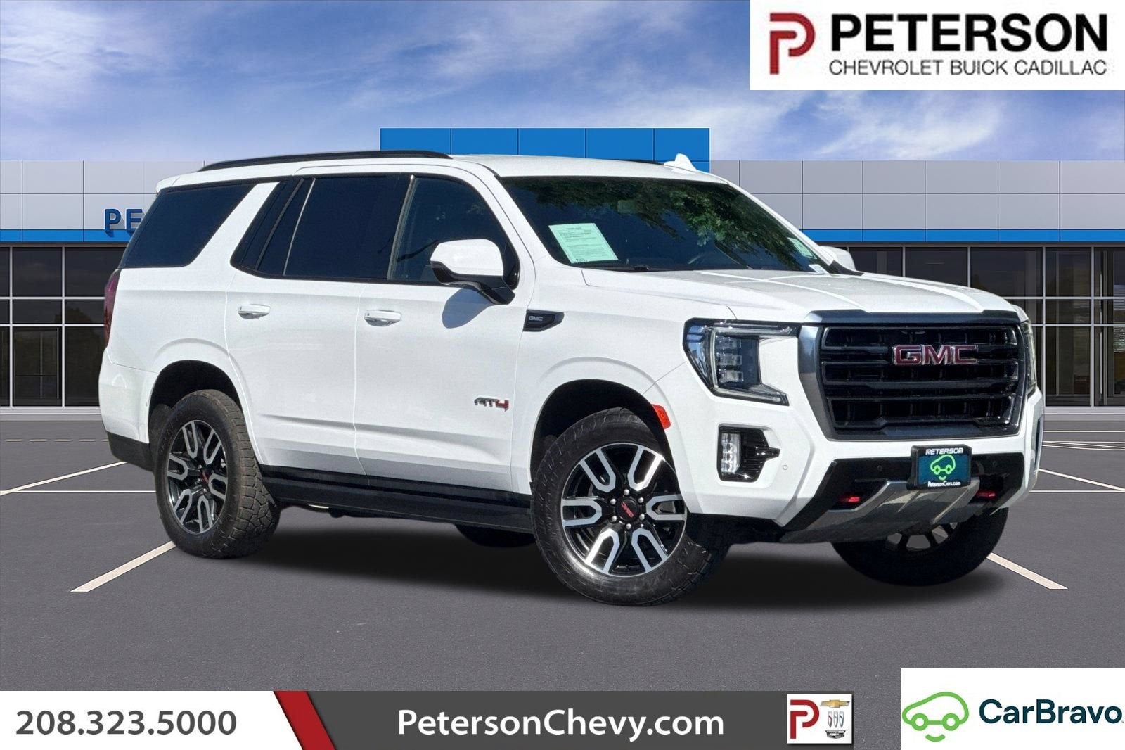 2022 GMC Yukon AT4 in Summit White — front three-quarter view