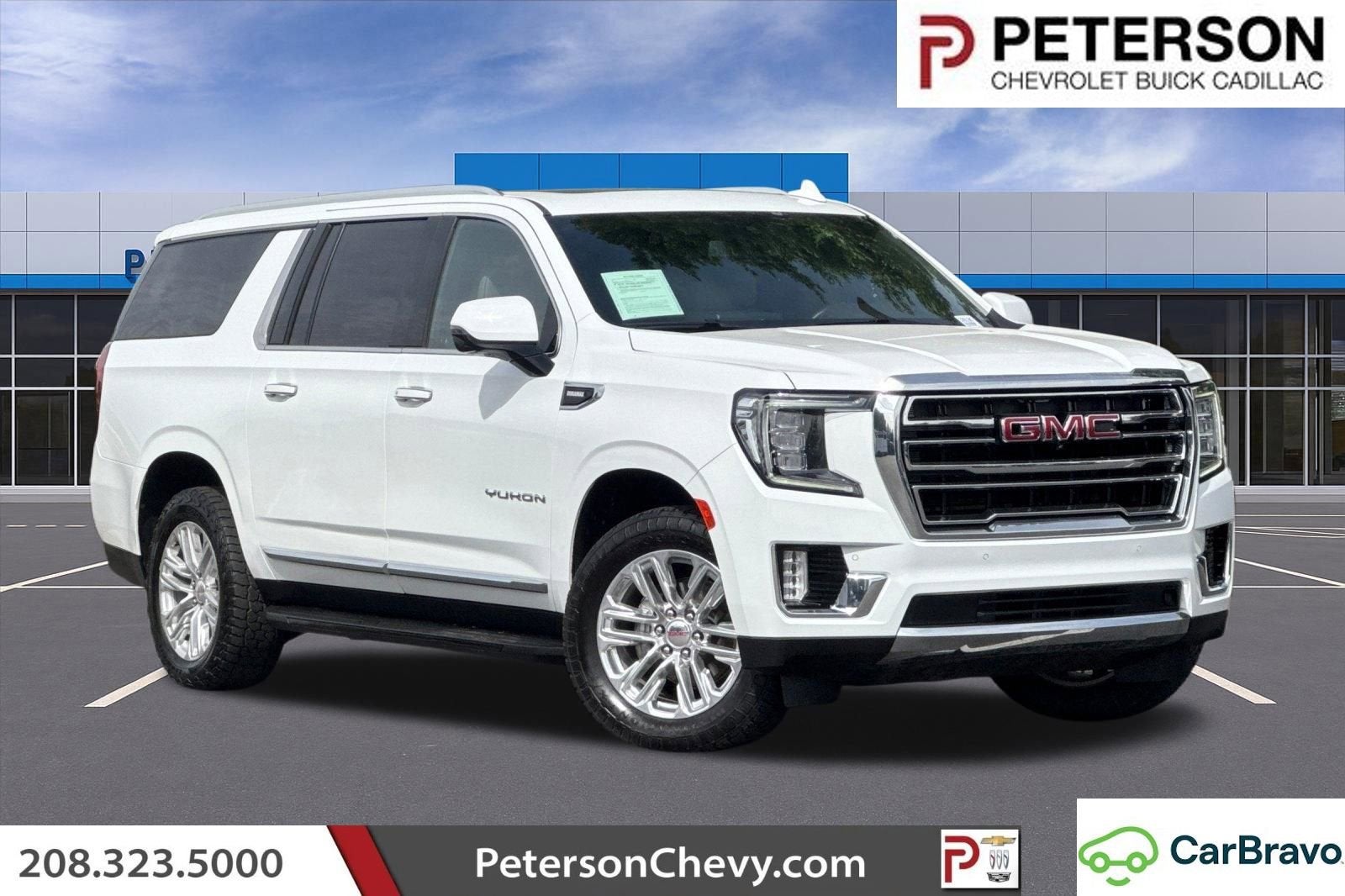 2024 GMC Yukon XL SLT in Summit White — front three-quarter view