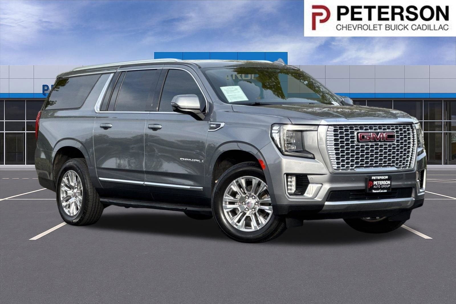 2021 GMC Yukon XL Denali in Satin Steel Metallic — front three-quarter view
