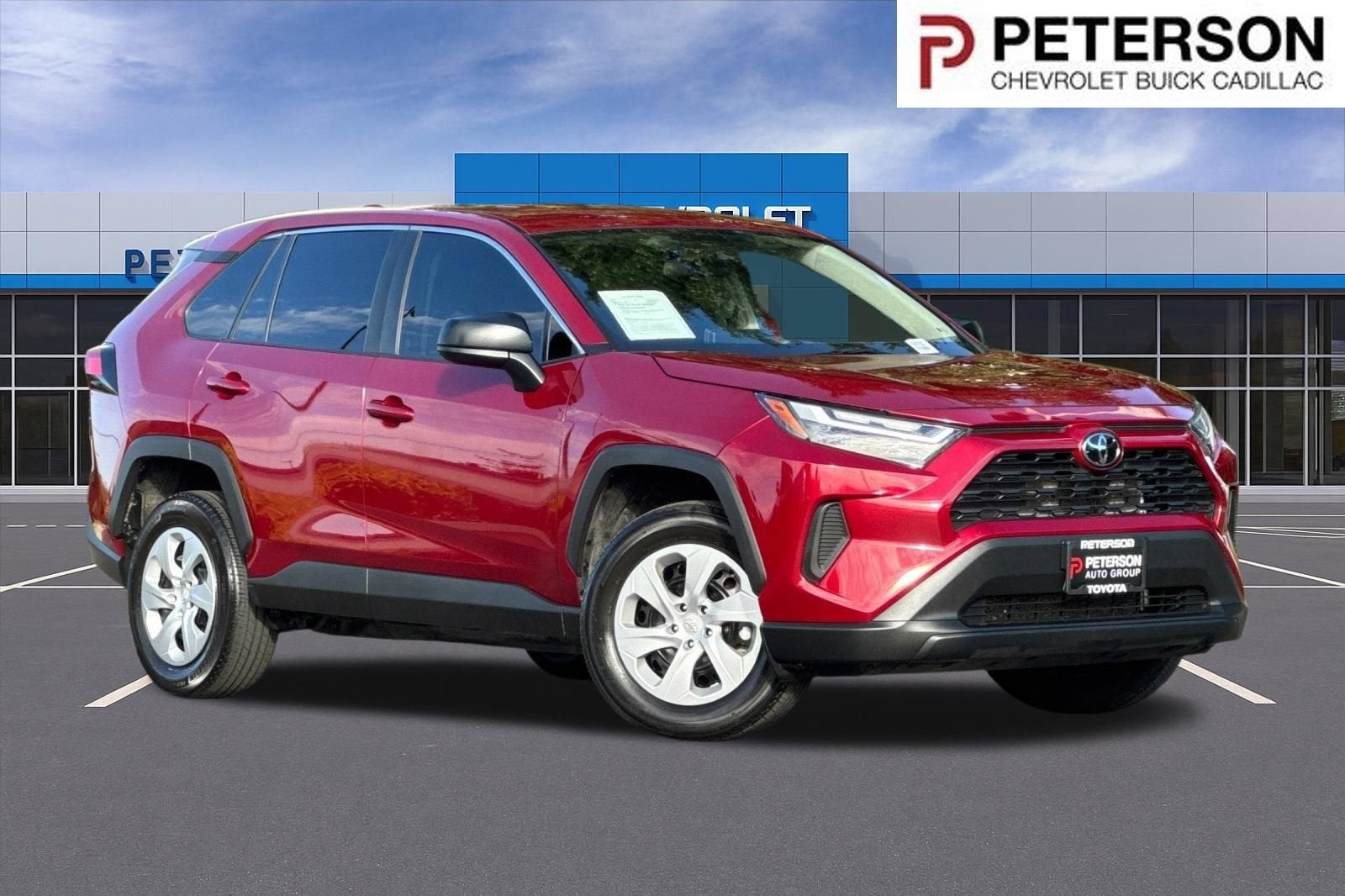 2024 Toyota RAV4 LE in Red — front three-quarter view