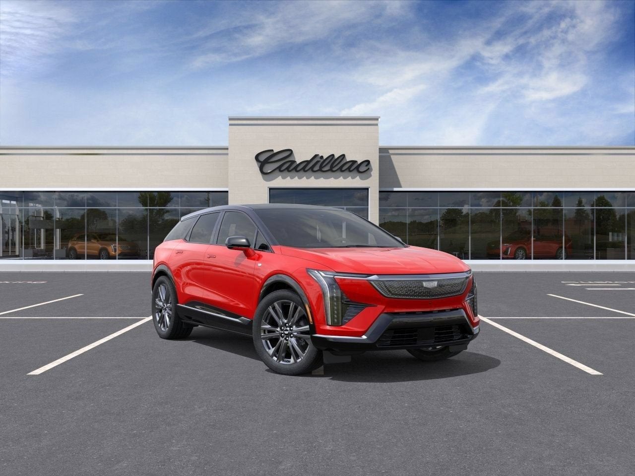2026 Cadillac OPTIQ Premium Sport in Monarch Orange — front three-quarter view