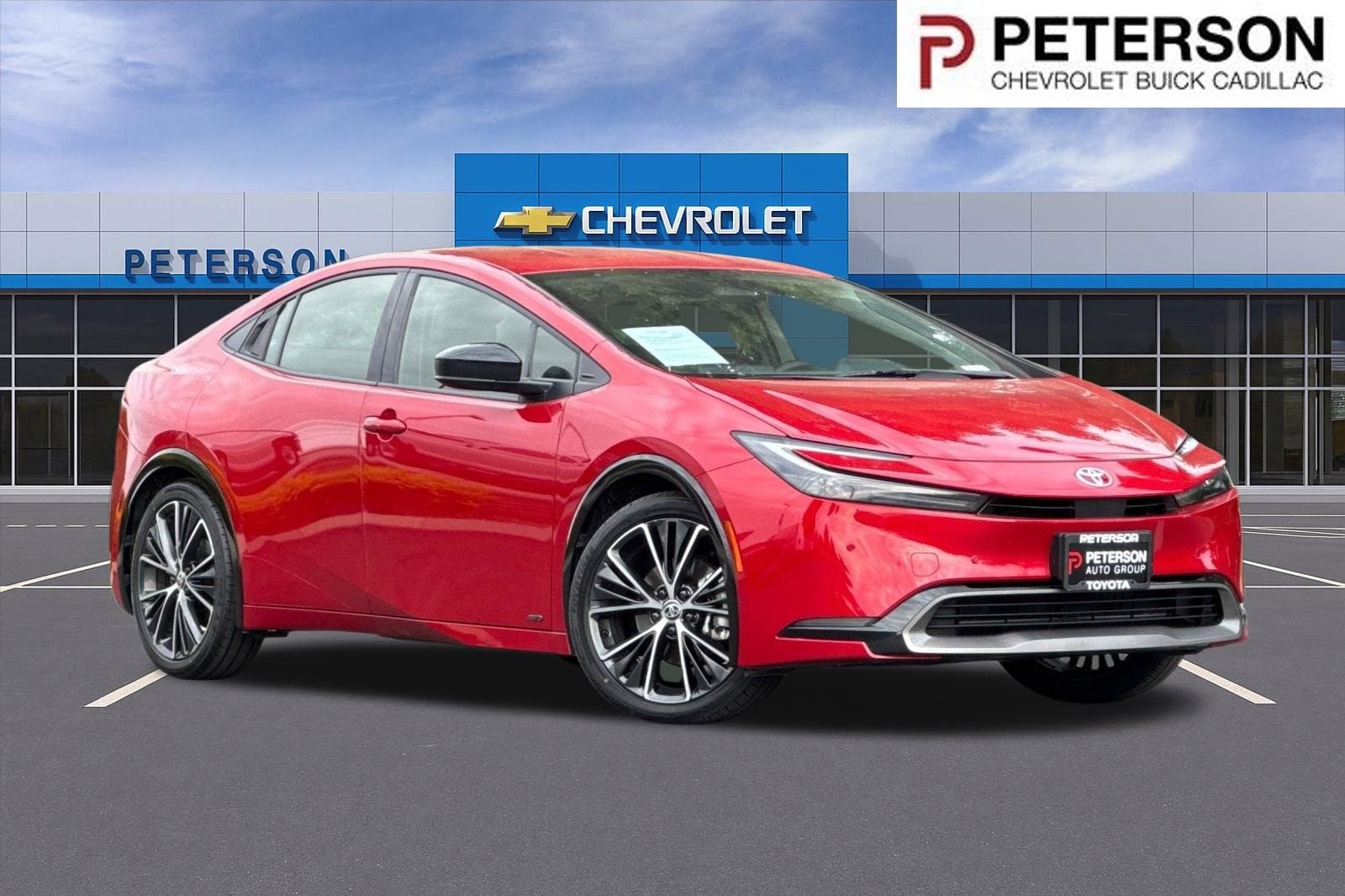 2024 Toyota Prius XLE AWD-e in Red — front three-quarter view